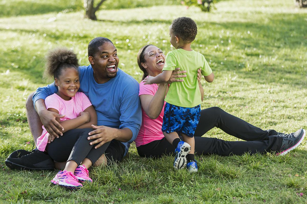 family sitting in grass.jpg