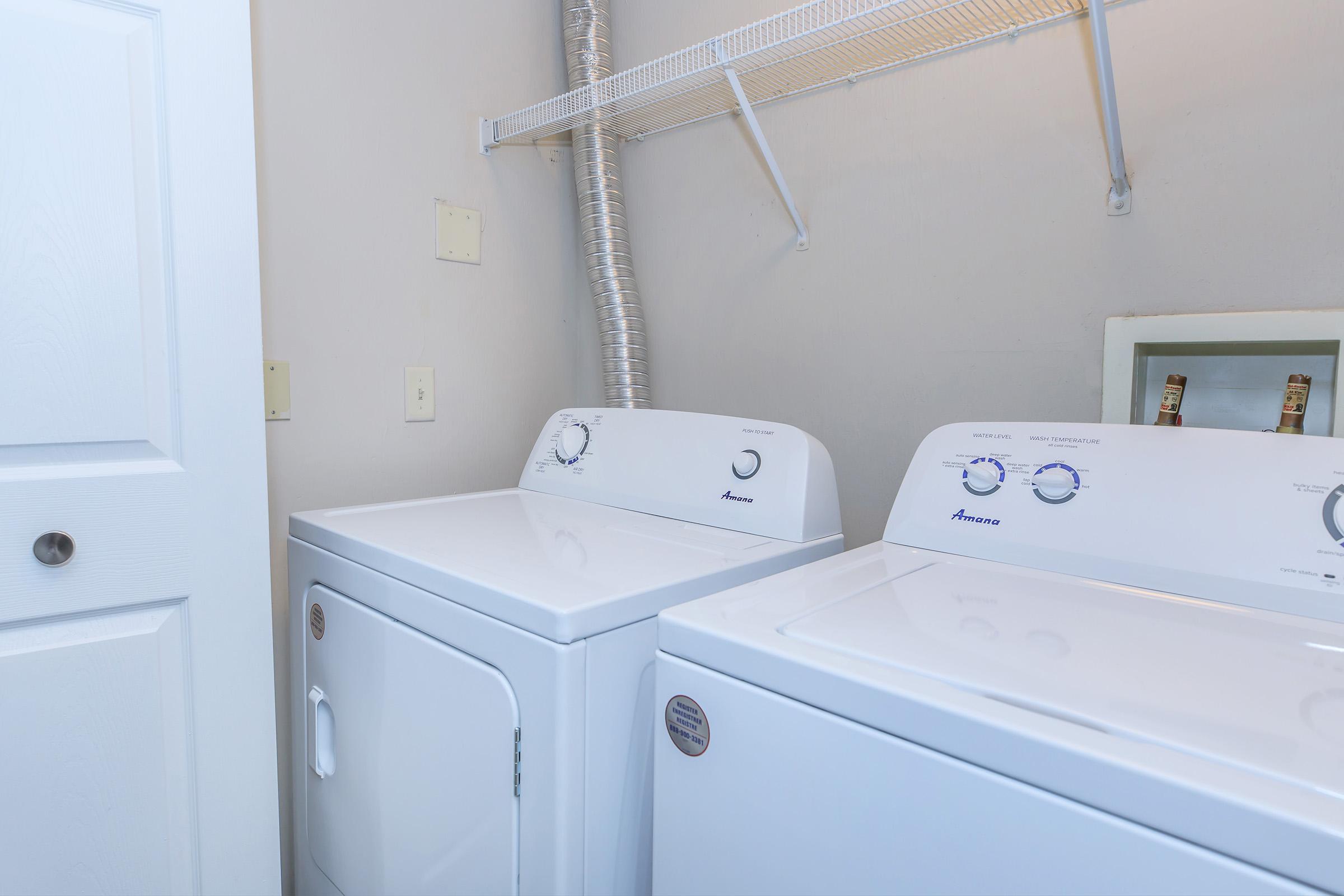 a kitchen with a sink and a refrigerator