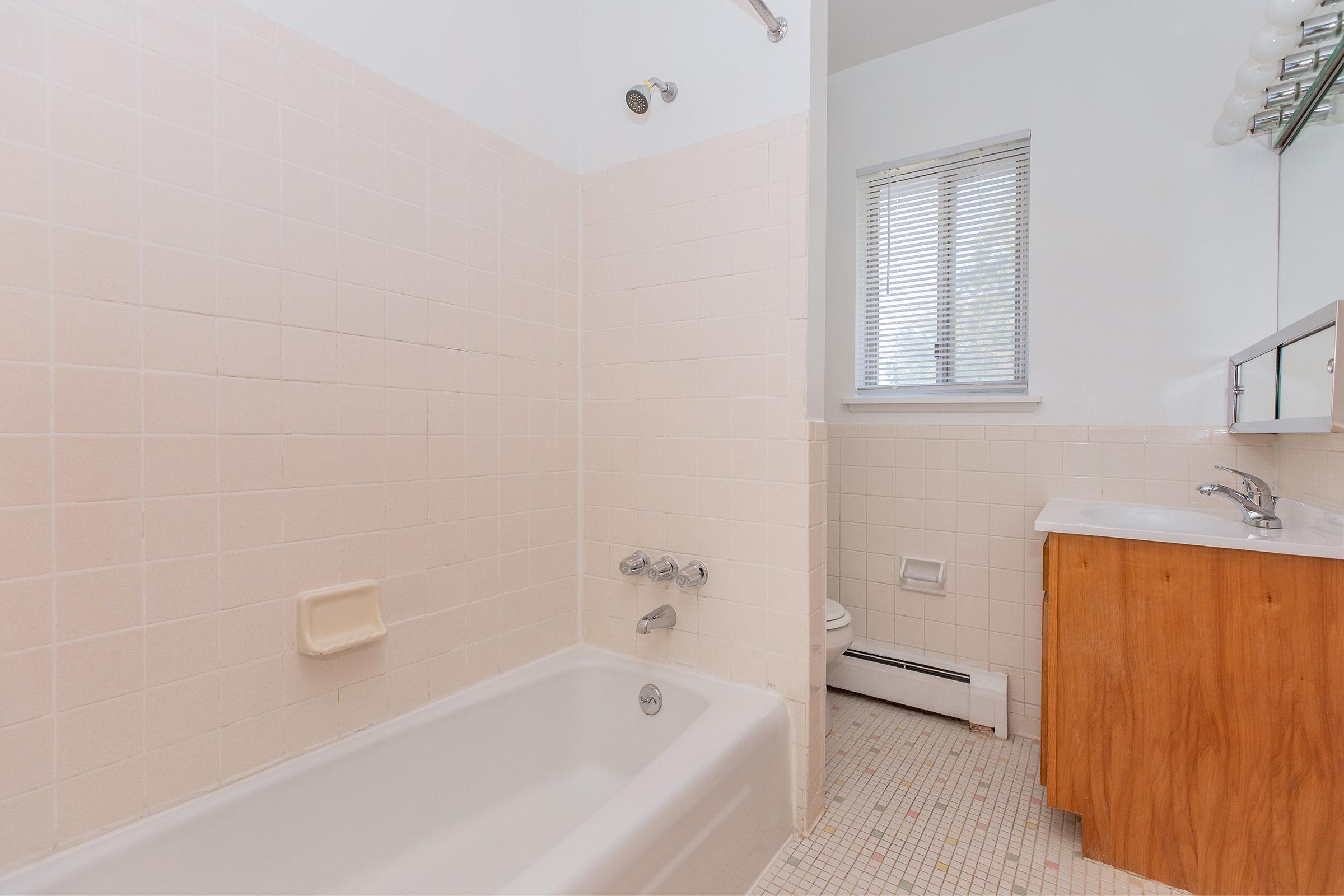 a close up of a sink and a bath tub