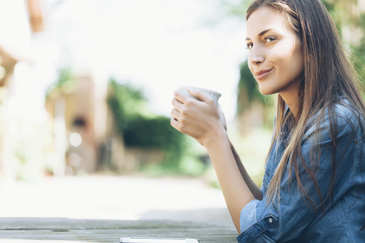 Young Woman Sitting Outdoors