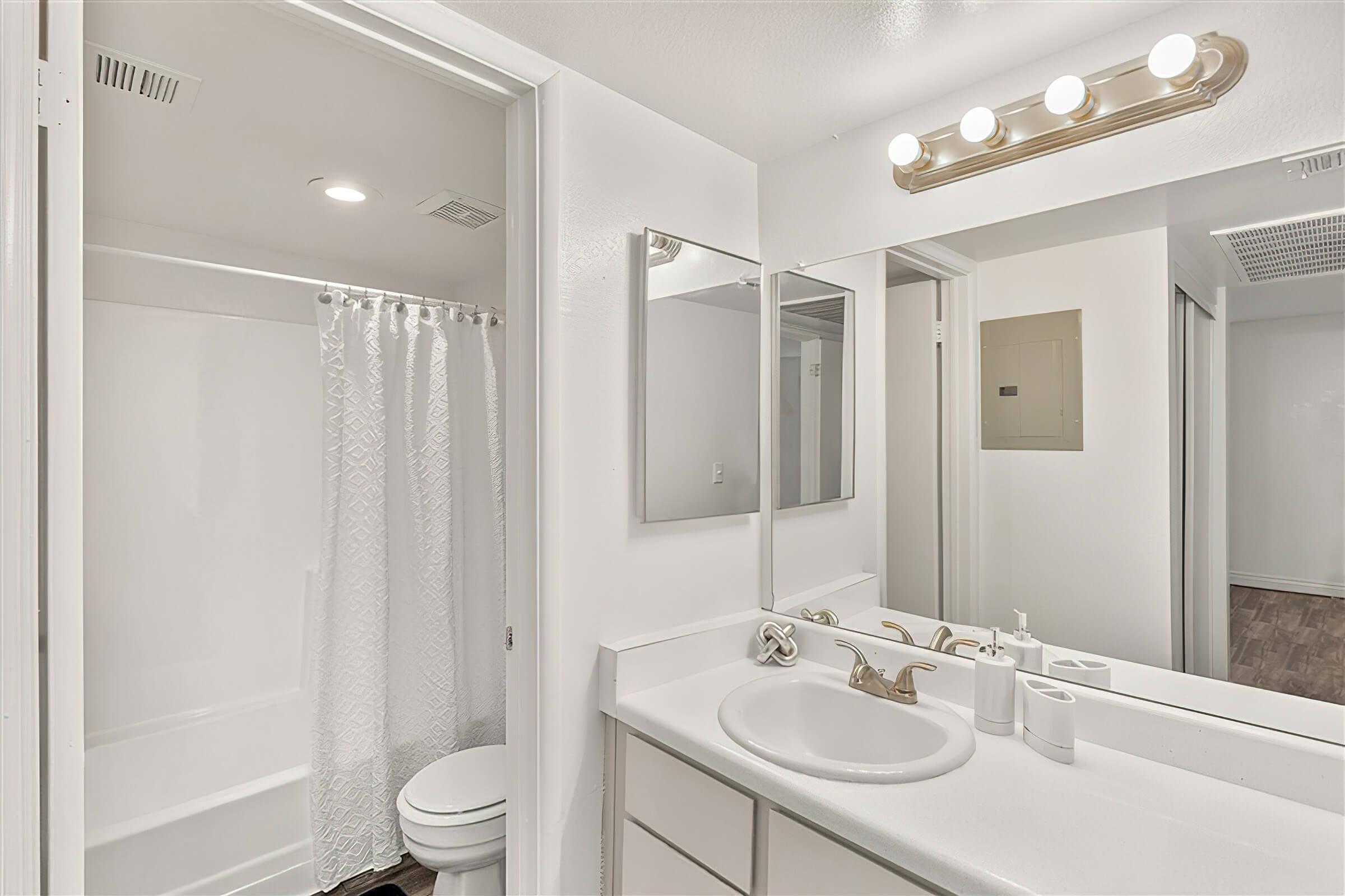 Modern and white bathroom with a separate toilet and shower room