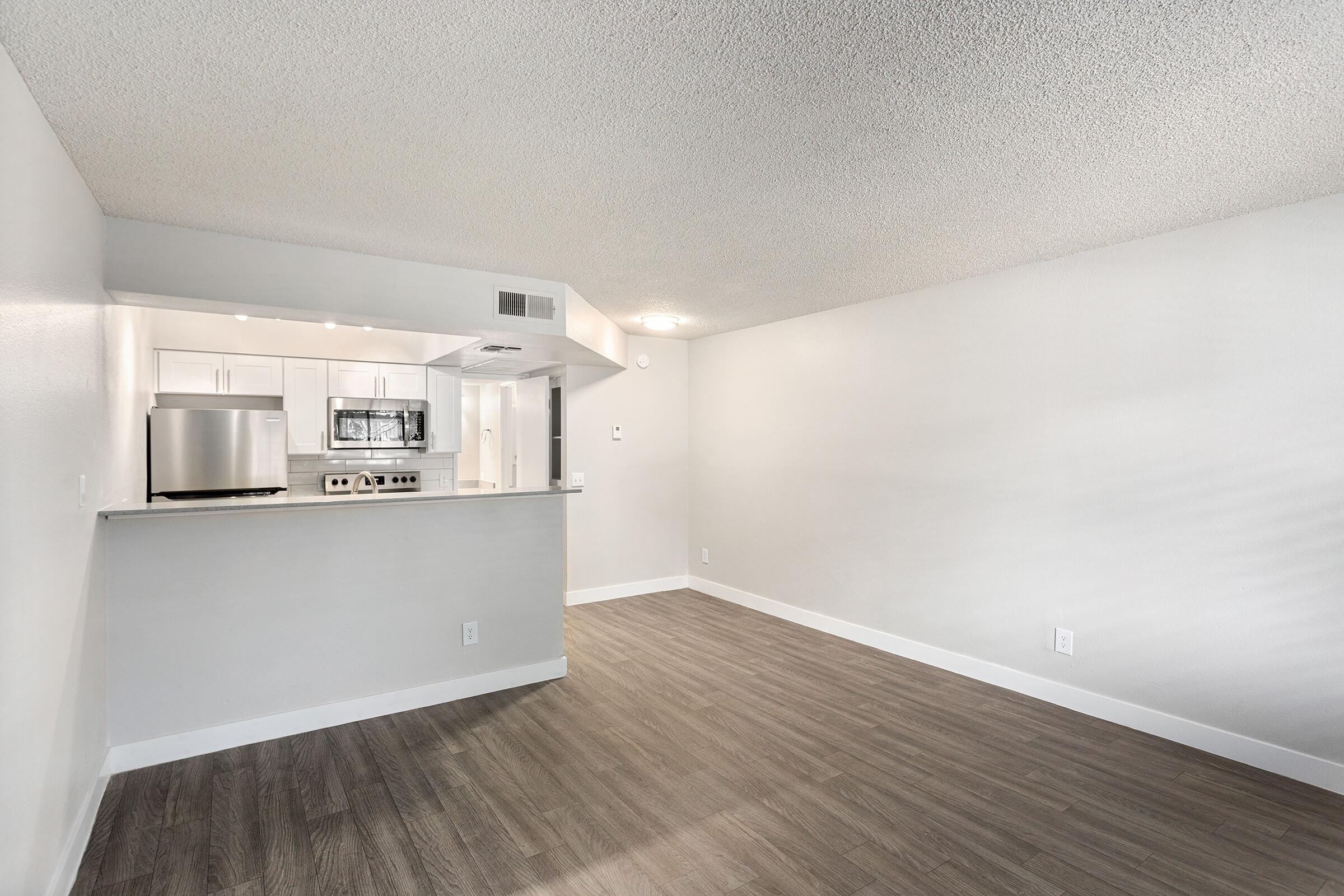 Spacious studio floor plan with a view of a fresh modern kitchen