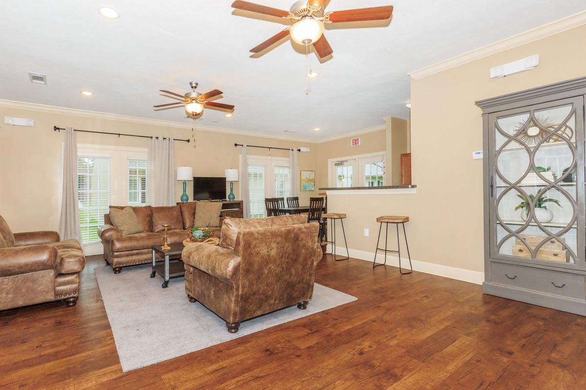 a living room filled with furniture and a fireplace