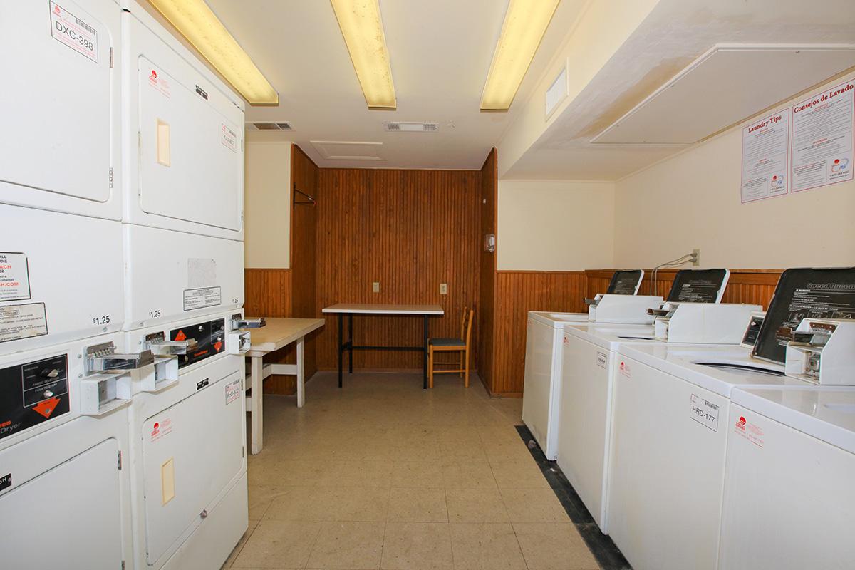 a white refrigerator freezer sitting inside of a kitchen