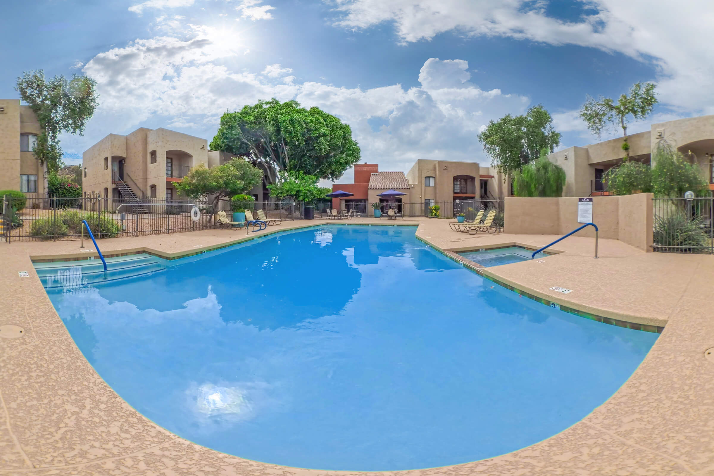 Pool and poolside area at Paradise Foothills Apartment Homes.