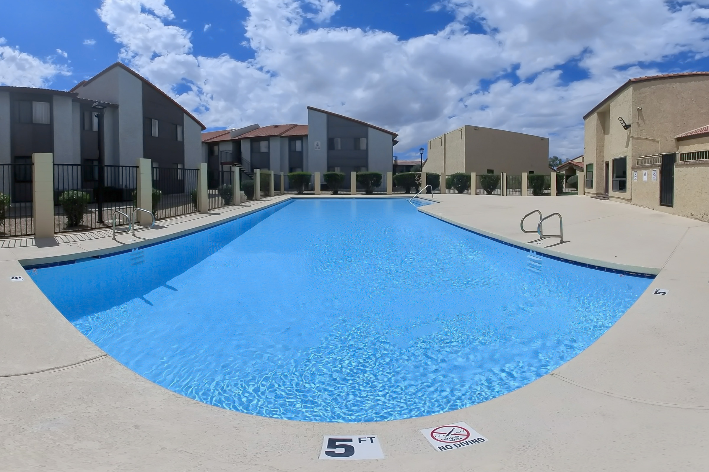 Pool and poolside area at Lynnwood Apartments.